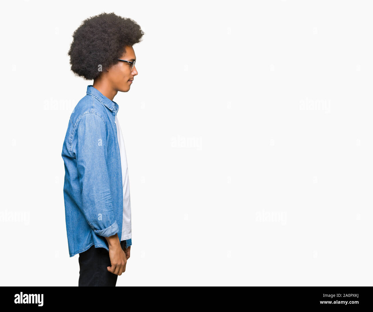 Young African American Man With Afro Hair Wearing Glasses Looking