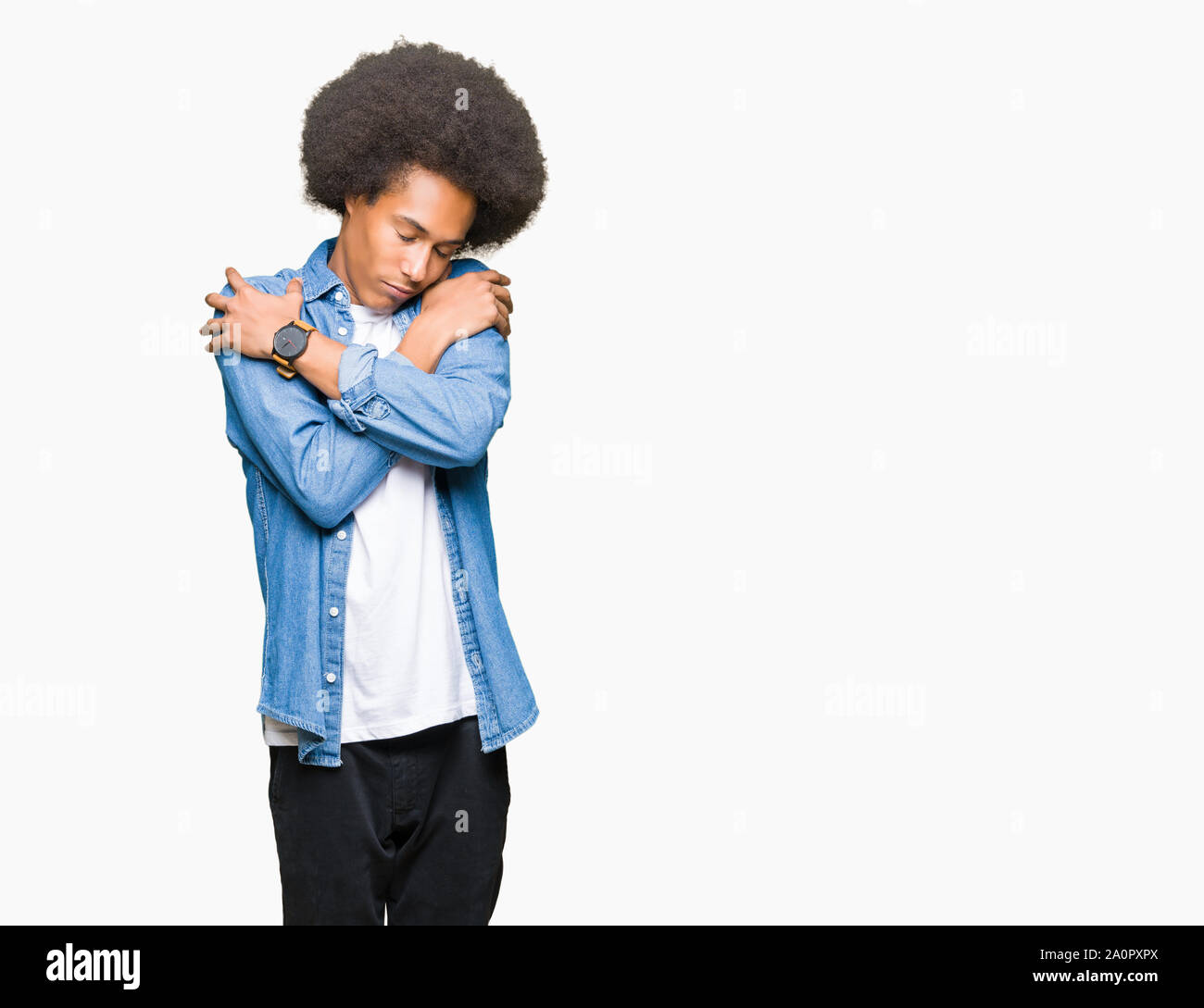Young African American Man With Afro Hair Hugging Oneself Happy