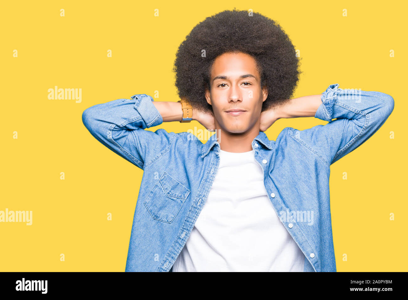Young African American Man With Afro Hair Relaxing And Stretching