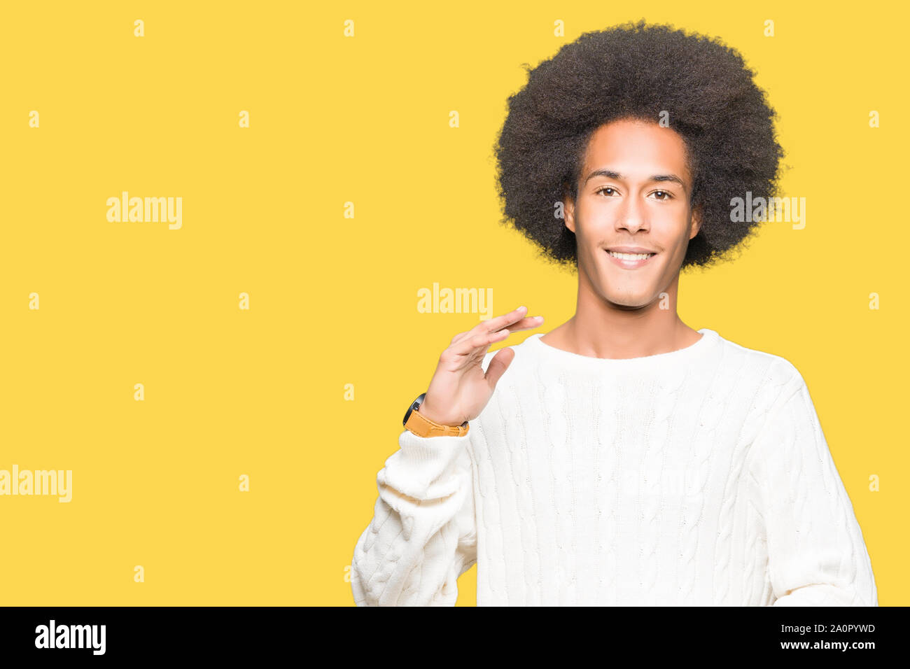 Young African American Man With Afro Hair Wearing Winter Sweater