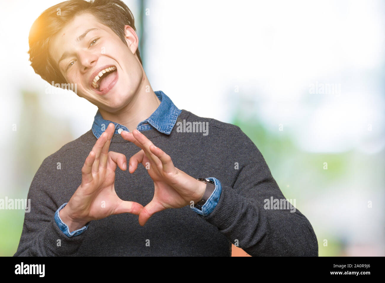 Young handsome elegant man over isolated background smiling in love ...