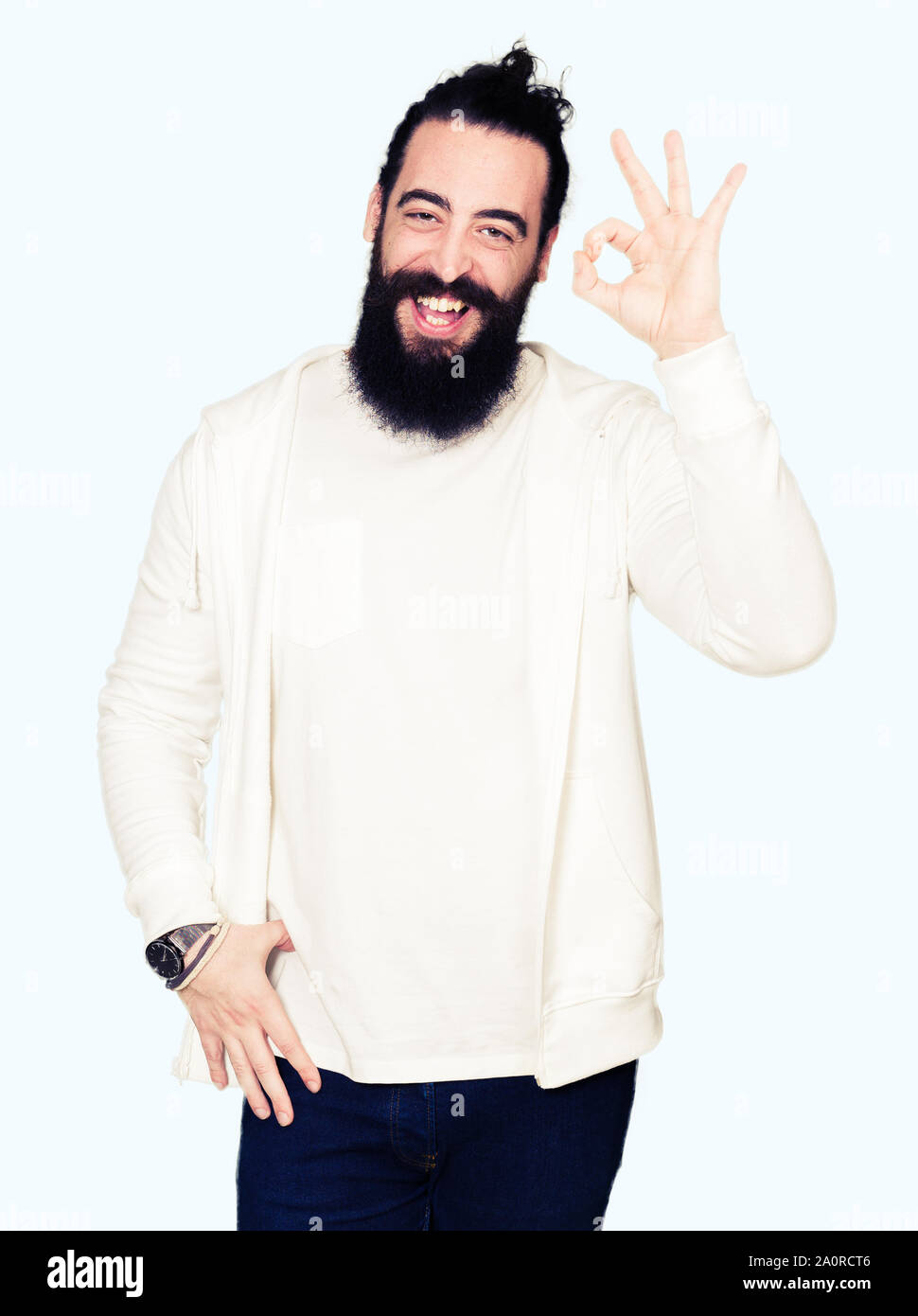 Young Man With Long Hair And Beard Wearing Sporty Sweatshirt