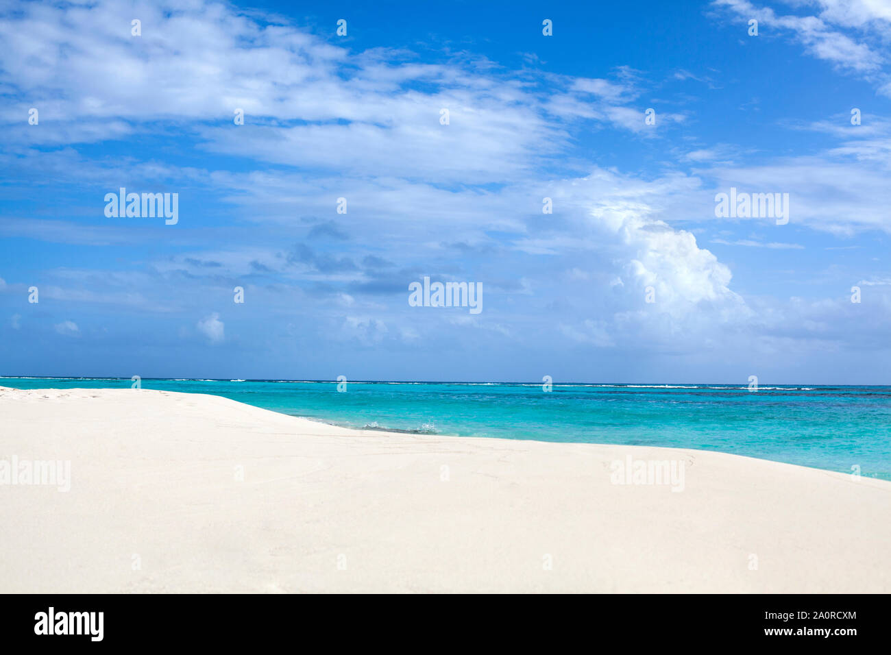 White sand beach, blue sea and sky with clouds background Stock Photo ...