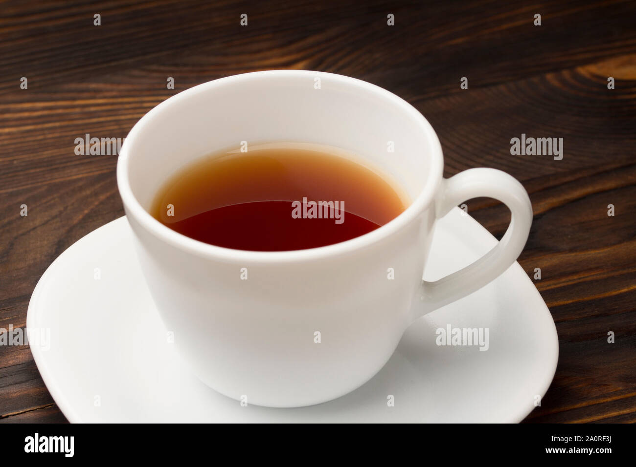 teacup and saucer on old wood texture background. Stock Photo