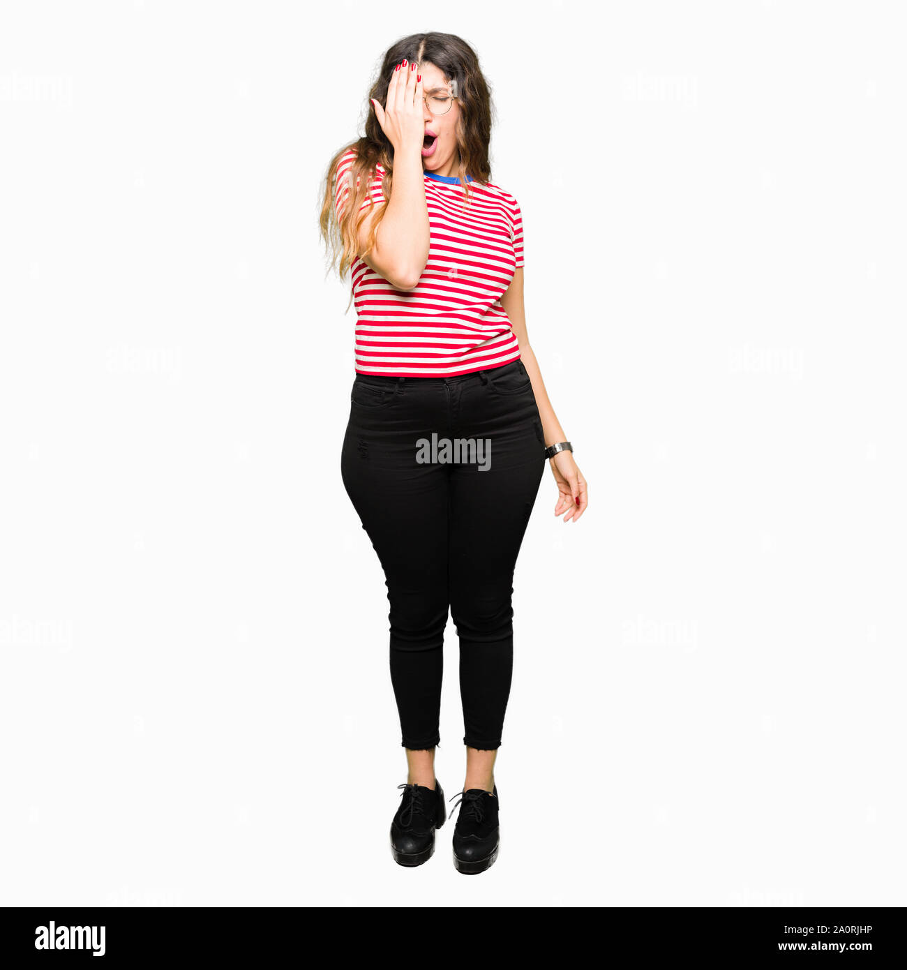 Young beautiful woman wearing glasses Yawning tired covering half face