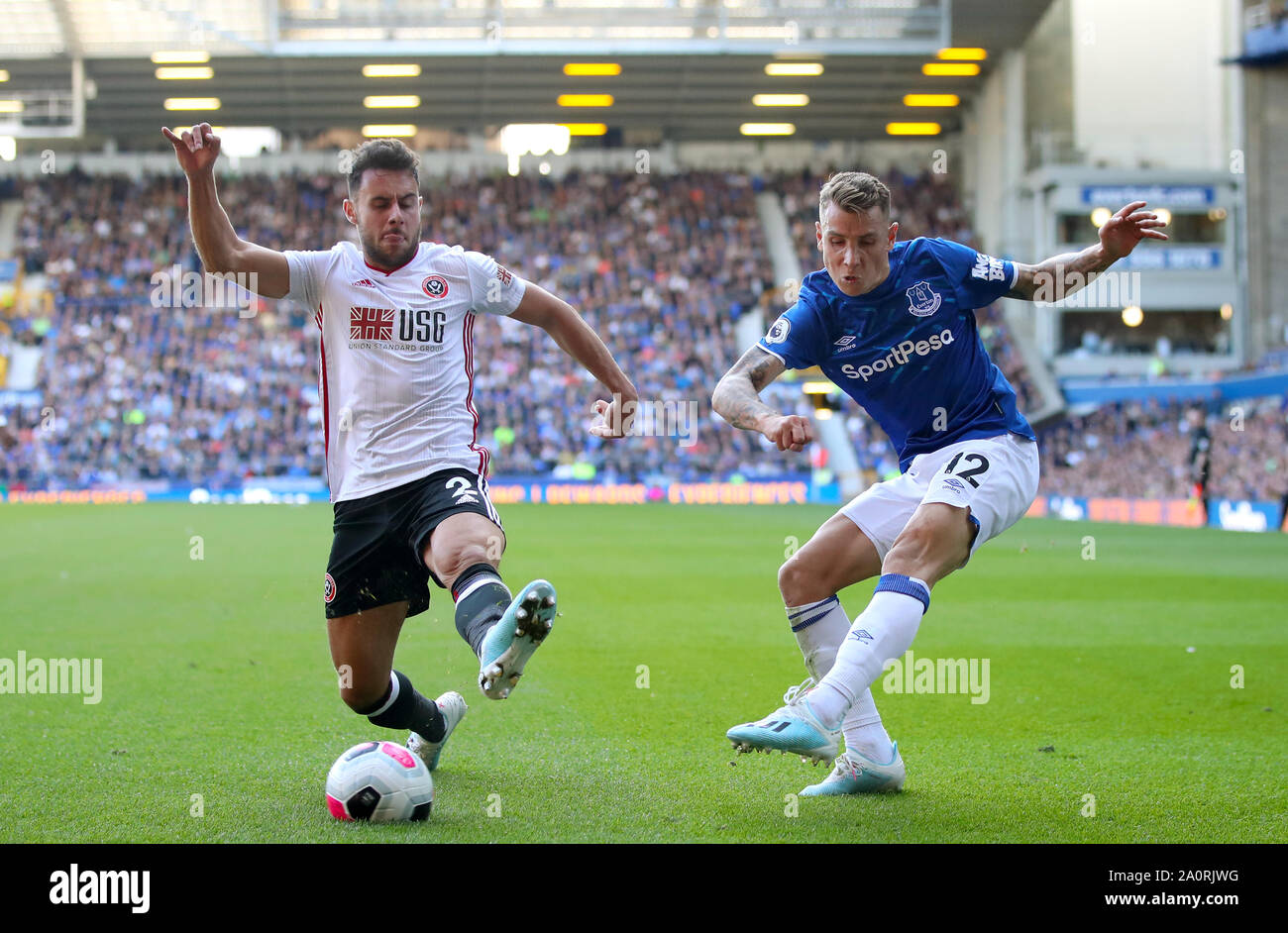 Sheffield United's George Baldock (left) and Everton's Lucas Digne battle for the ball during the Premier League match at Goodison Park, Liverpool. Stock Photo