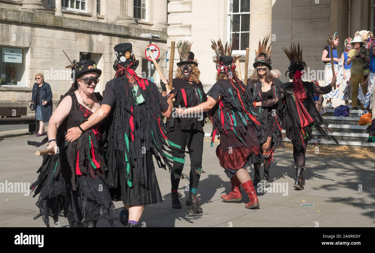 Stroud, UK. 21st September 2019. Stroud, a Cotswold town hosts its annual Folk weekend. Morris dancers from around the Cotswolds and Forest of Dean prance around the town entertaining the shoppers, ending with a grand gathering in the square. Morris Dancing is a traditional English pastime, once associated with begging in the 15th to 18th centuries. Begging was illegal at the time; so blackface was adopted as a disguise. The group is Styx of Stroud. Credit: Mr Standfast/Alamy Live News Stock Photo