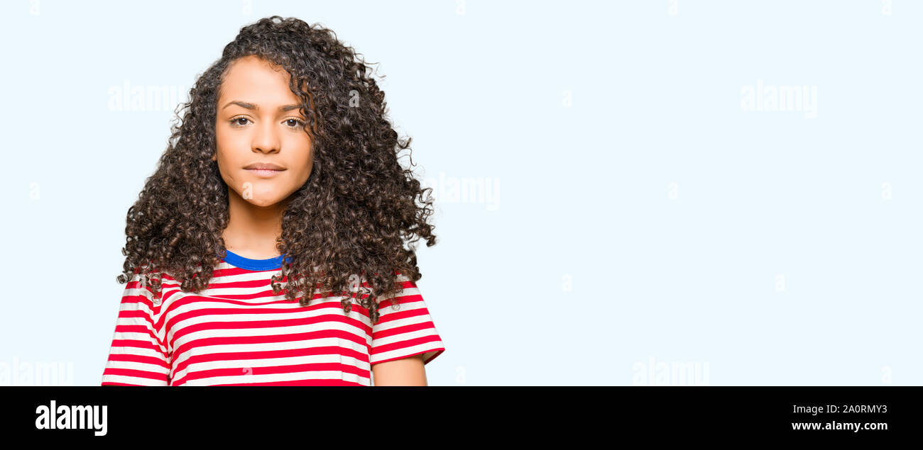 Young Beautiful Woman With Curly Hair Wearing Stripes T Shirt With