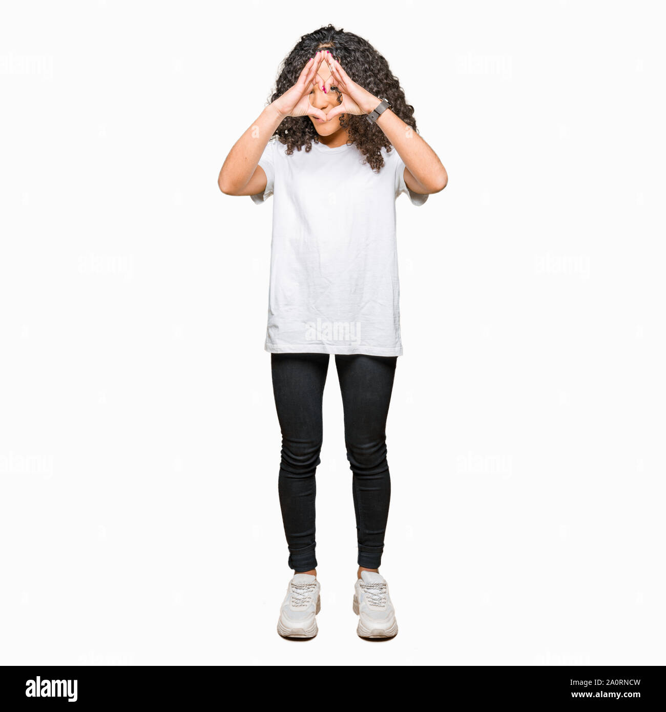 Young Beautiful Woman With Curly Hair Wearing White T Shirt Doing