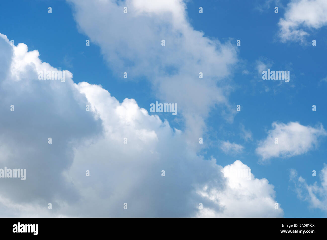 Blue sky with bright clouds background. Nature backdrop Stock Photo