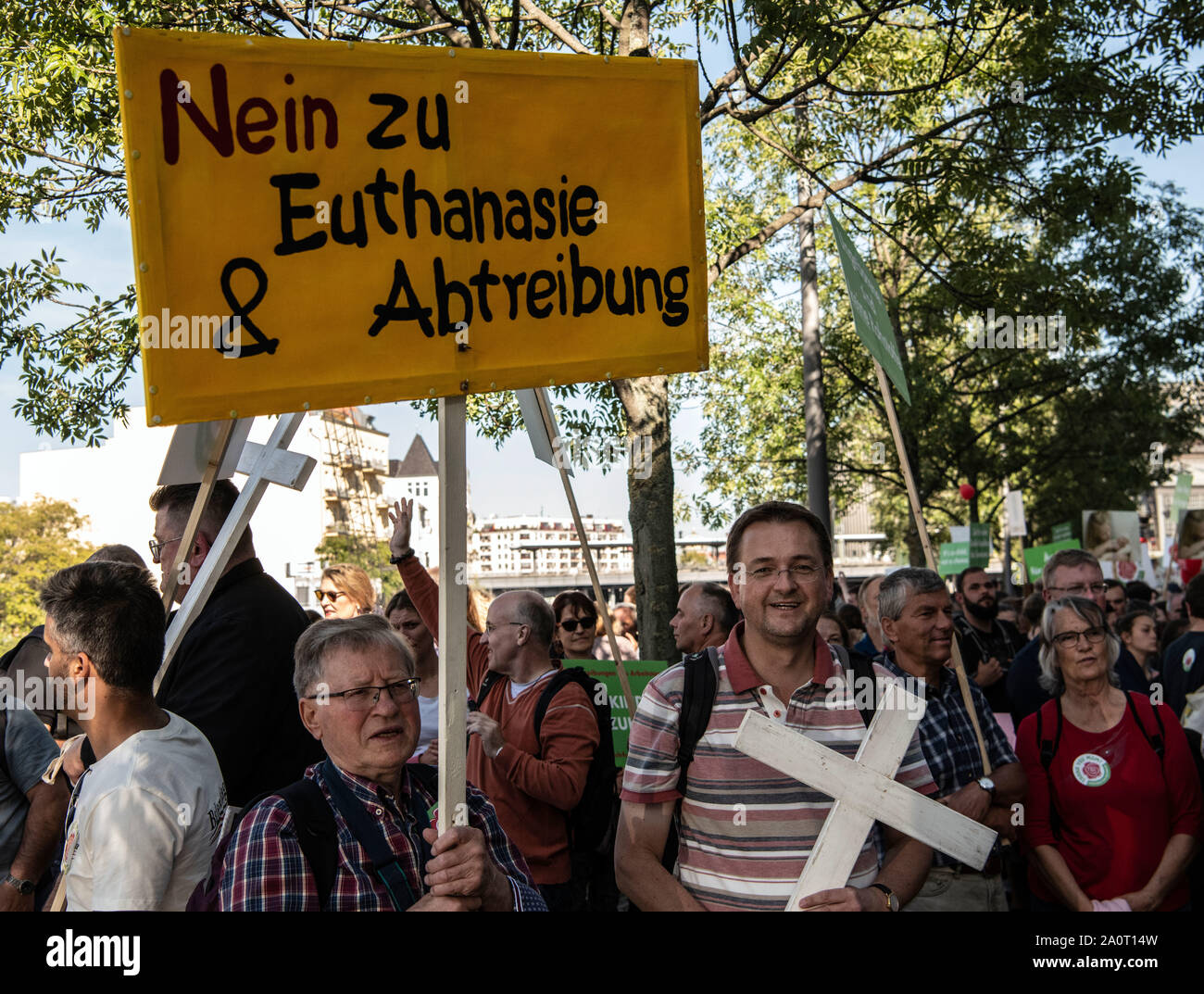Berlin, Germany. 21st Sep, 2019. A participant of the so-called 'march for life' holds a sign with the inscription 'No to euthanasia and abortion' in the government district. According to the organizer, the association Bundesverband Lebensrecht, the Catholic Church, as well as doctors' and lawyers' associations participated in the 'March for Life'. Hundreds of people demonstrated in Berlin-Mitte against a demonstration by anti-abortion activists. Credit: Paul Zinken/dpa/Alamy Live News Stock Photo