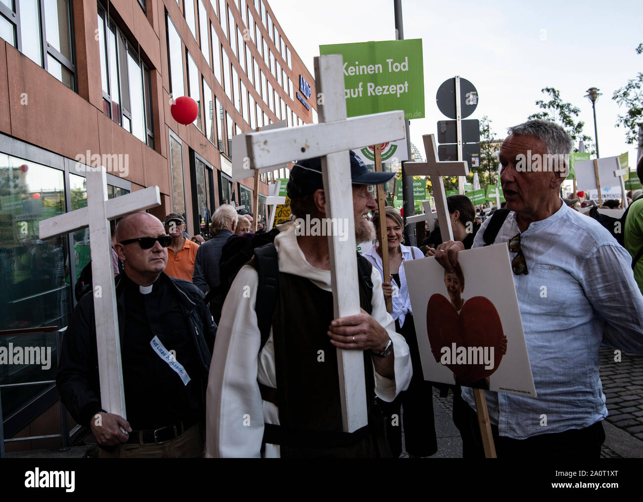 Berlin, Germany. 21st Sep, 2019. Participants of the so-called 'March for Life' hold posters and wooden crosses in the government district. According to the organizer, the association Bundesverband Lebensrecht, the Catholic Church, as well as doctors' and lawyers' associations participated in the 'March for Life'. Hundreds of people demonstrated in Berlin-Mitte against a demonstration by anti-abortion activists. Credit: Paul Zinken/dpa/Alamy Live News Stock Photo