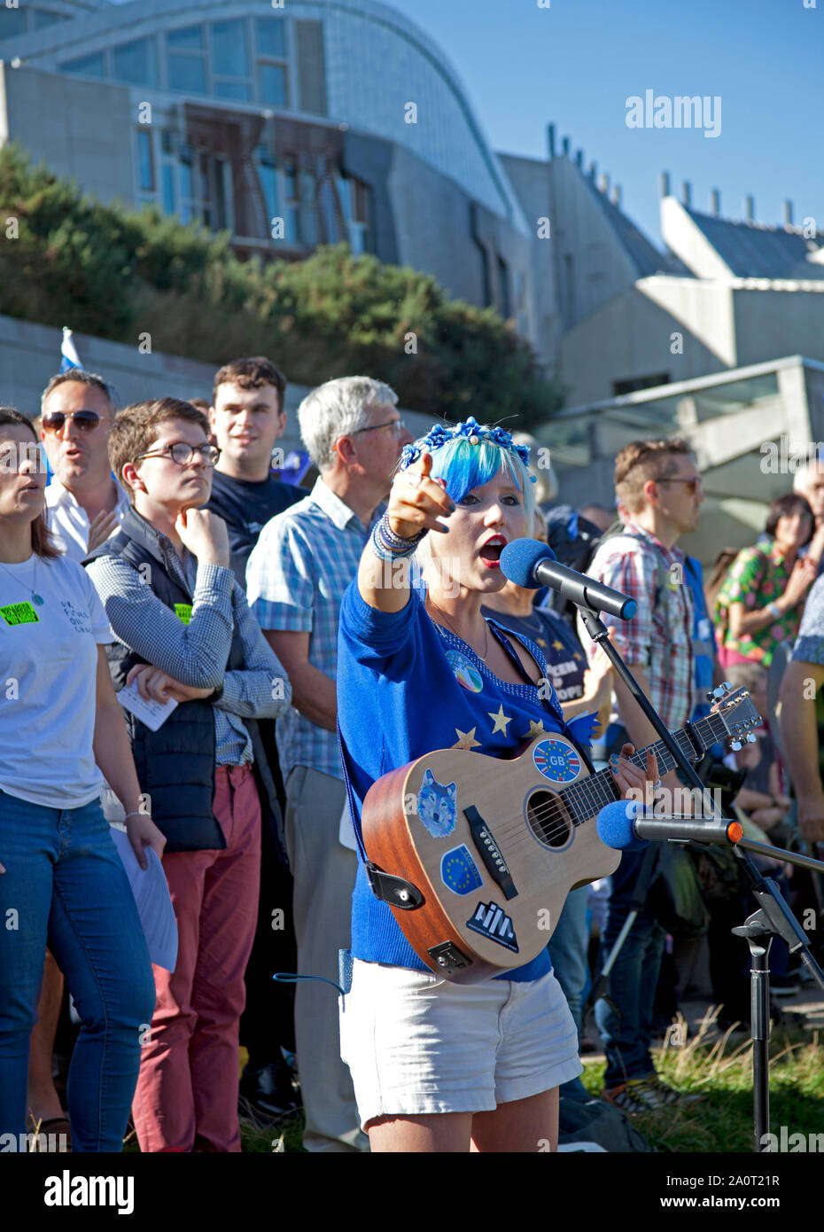 Holyrood Park, Edinburgh, Scotland, UK. 21st September 2019. Rally against Brexit after Royal Mile march, held in Holyrood Park outside Scottish Parliament. Speakers pictured, Madeleina Kay known as #EUsupergirl for her creative campaigning to stop Brexit,who was awarded 'Young European of the Year 2018' by the European Parliament, Stock Photo