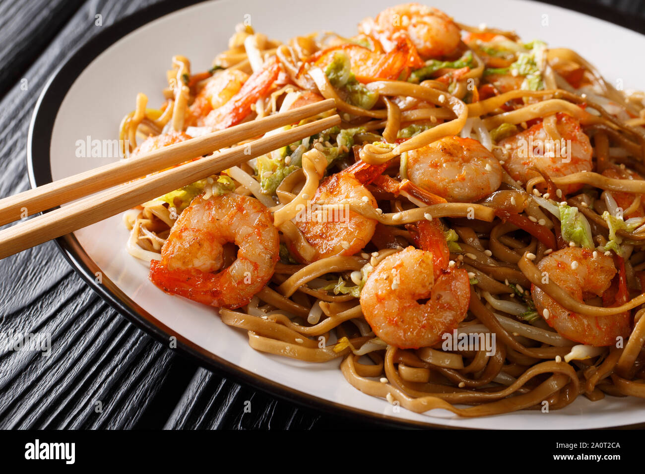 Chinese Food Chow Mein Noodles With Shrimp Vegetables And Sesame Seeds Close Up On A Plate On The Table Horizontal Stock Photo Alamy