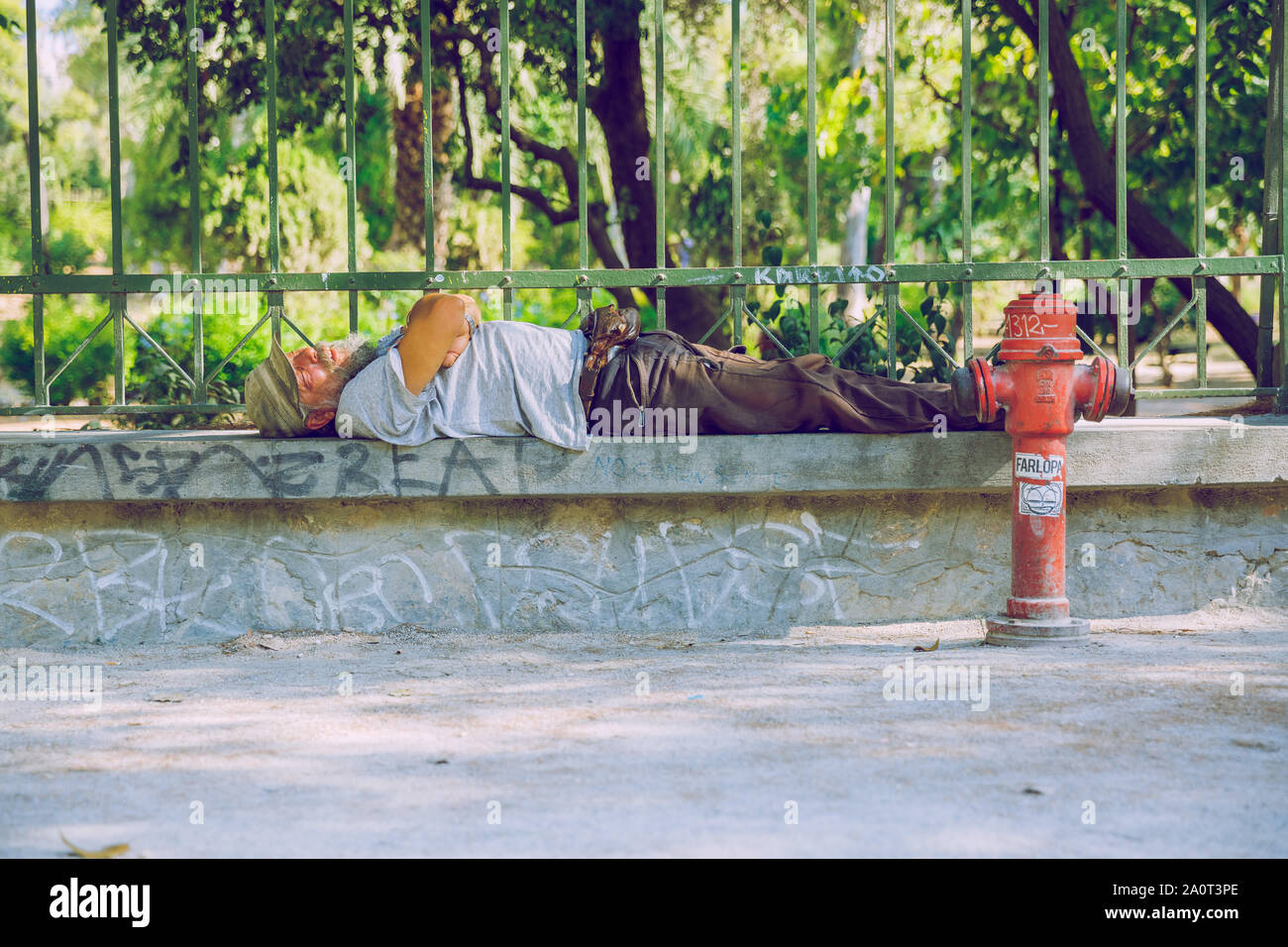 City Athens, Greek Republic. Man leep on the street. Urban city  life. 11. Sep. 2019 Stock Photo