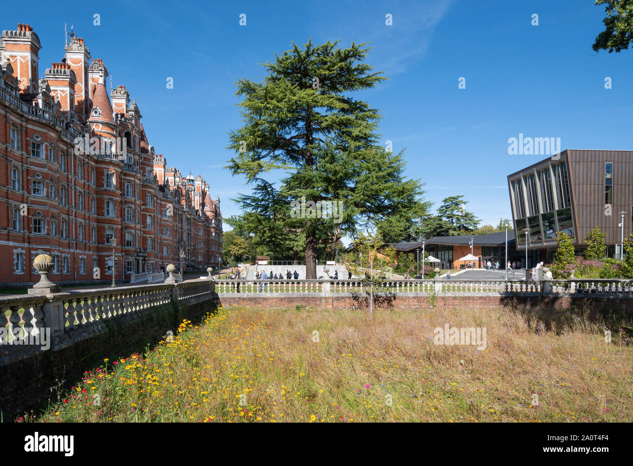 The historic Founder's Building at Royal Holloway College in Surrey, UK, part of the University of London, and the new Emily Wilding Davison Building Stock Photo