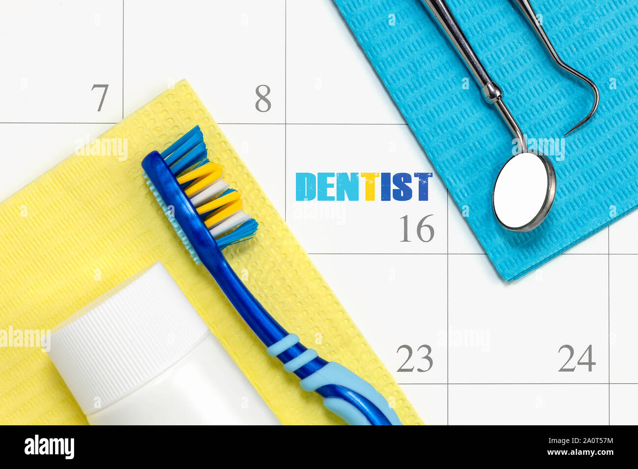 Dentist appointment and dental check up health care concept reminder in month calendar with toothbrush dental tools and toothpaste. Stock Photo
