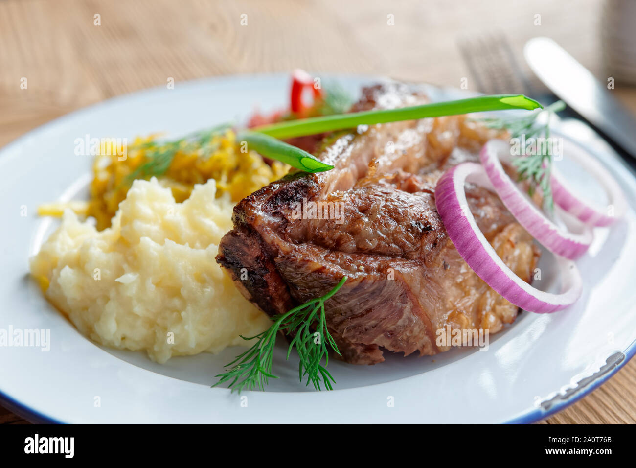 Grilled pork ribs with sauerkraut and mashed potatoes - hearty dish ...