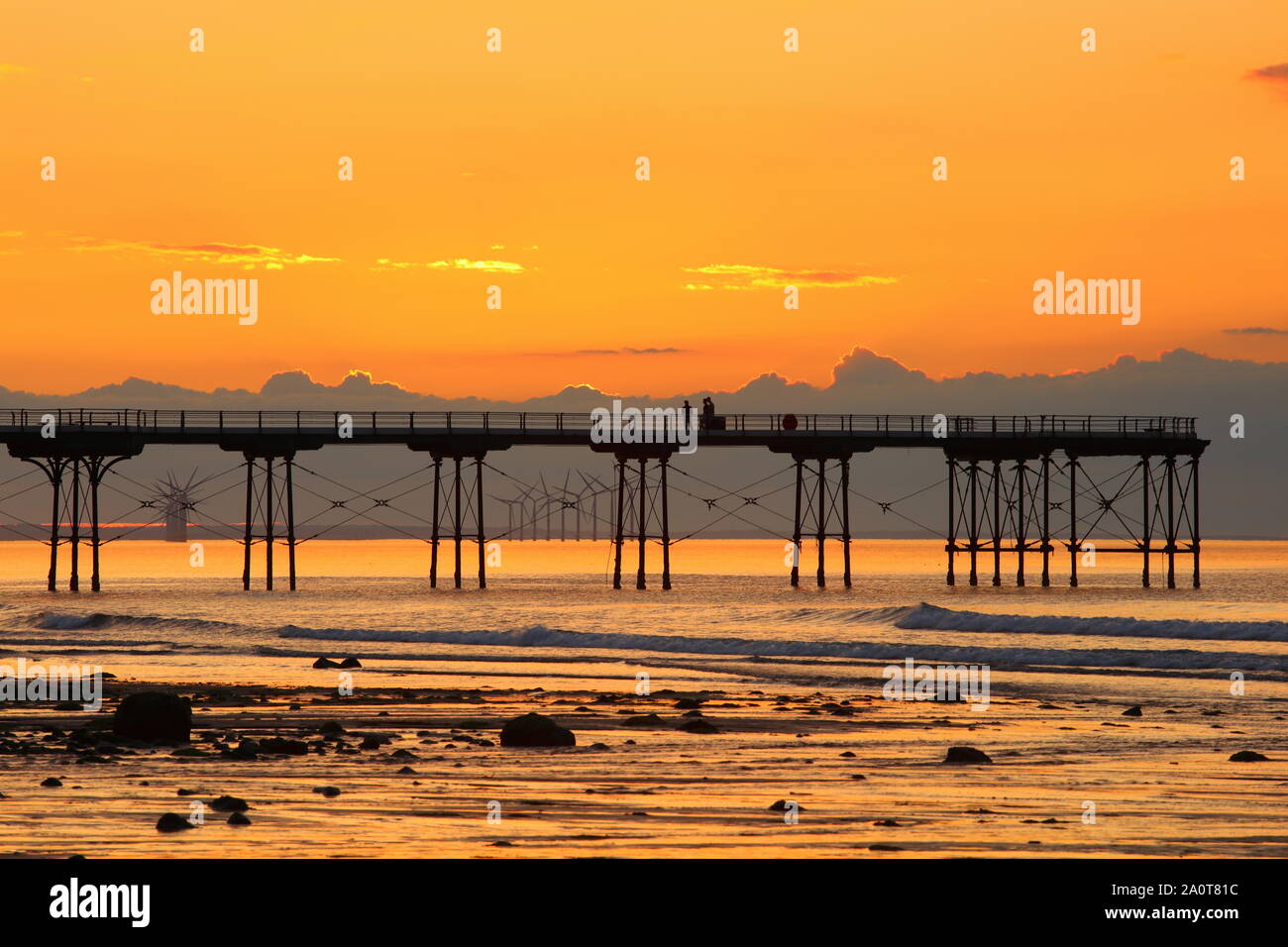 Sunset at Saltburn beach with a Silhouette of a Pier, North Yorkshire Coast, England, United Kingdom. Stock Photo