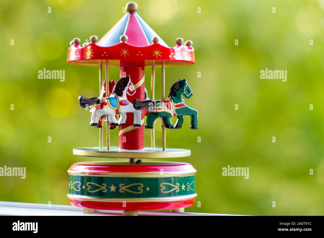 Vintage Musical Carousel Toy In Garden Stock Photo Alamy