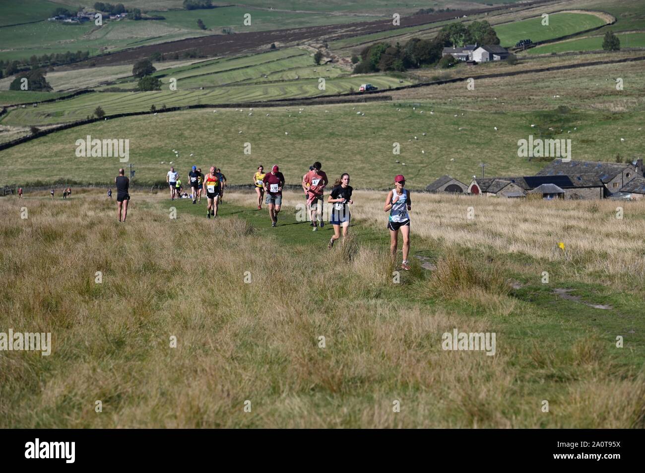 Fell runners in the annual Lantern Pike Race at Little Hayfield, Derbyshire Stock Photo