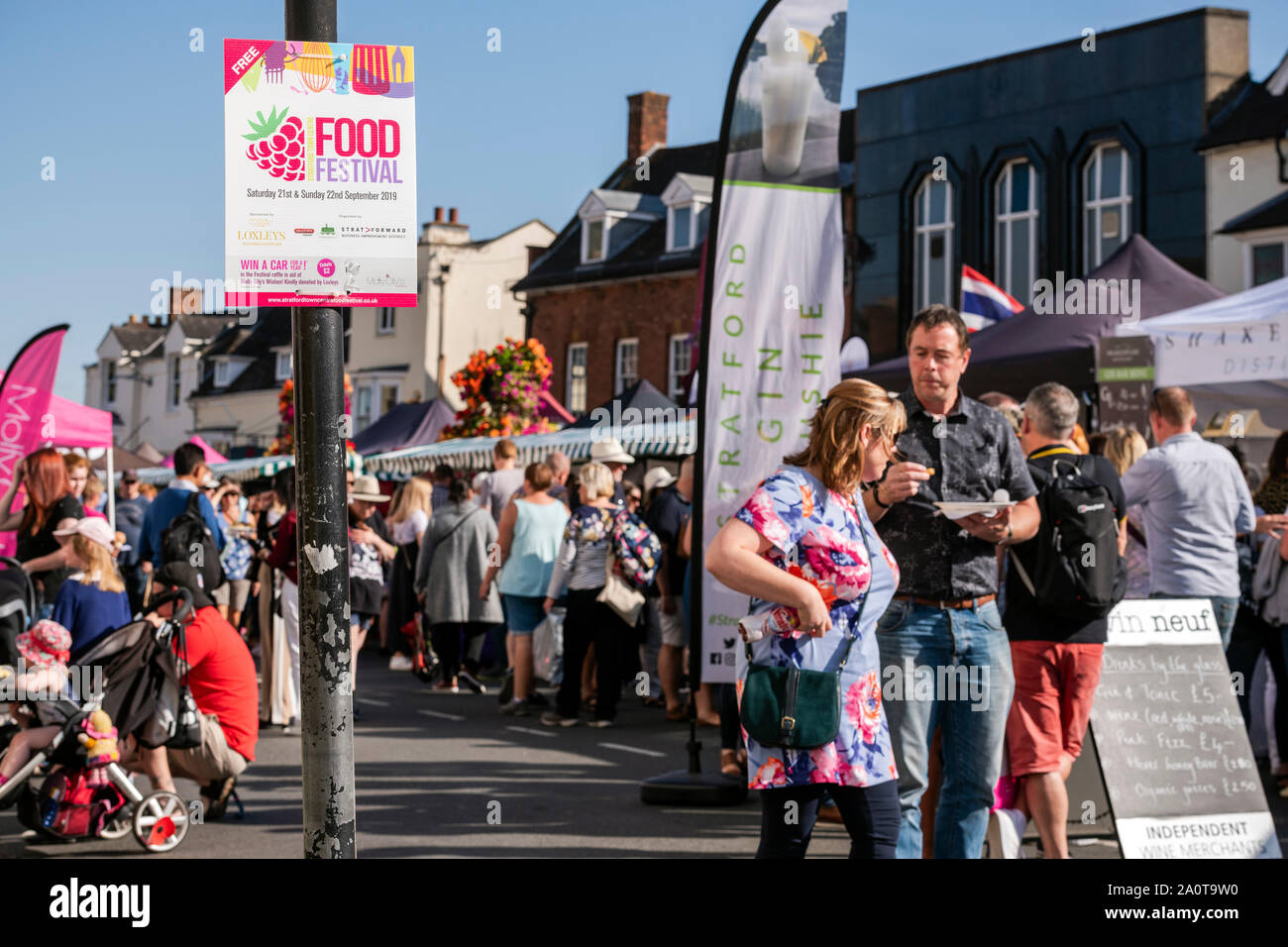 People at the Stratford upon Avon food festival, England, UK. Tourists buying food from stalls in the street. Stock Photo