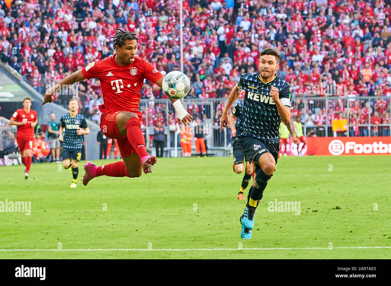 Munich, Germany. 21st Sep, 2019. Serge GNABRY, FCB 22 compete for the ball, tackling, duel, header, zweikampf, action, fight against Jonas HECTOR, 1.FCK 14 FC BAYERN MUNICH - 1.FC KÖLN 4-0 - DFL REGULATIONS PROHIBIT ANY USE OF PHOTOGRAPHS as IMAGE SEQUENCES and/or QUASI-VIDEO - 1.German Soccer League, Munich, September 21, 2019 Season 2019/2020, matchday 05, FCB, München, Cologne Credit: Peter Schatz/Alamy Live News Stock Photo