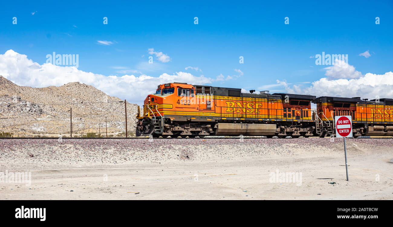 California USA. May 30, 2019. Freight BNSF train in California countryside, desert background, panoramic view, sunny spring day Stock Photo