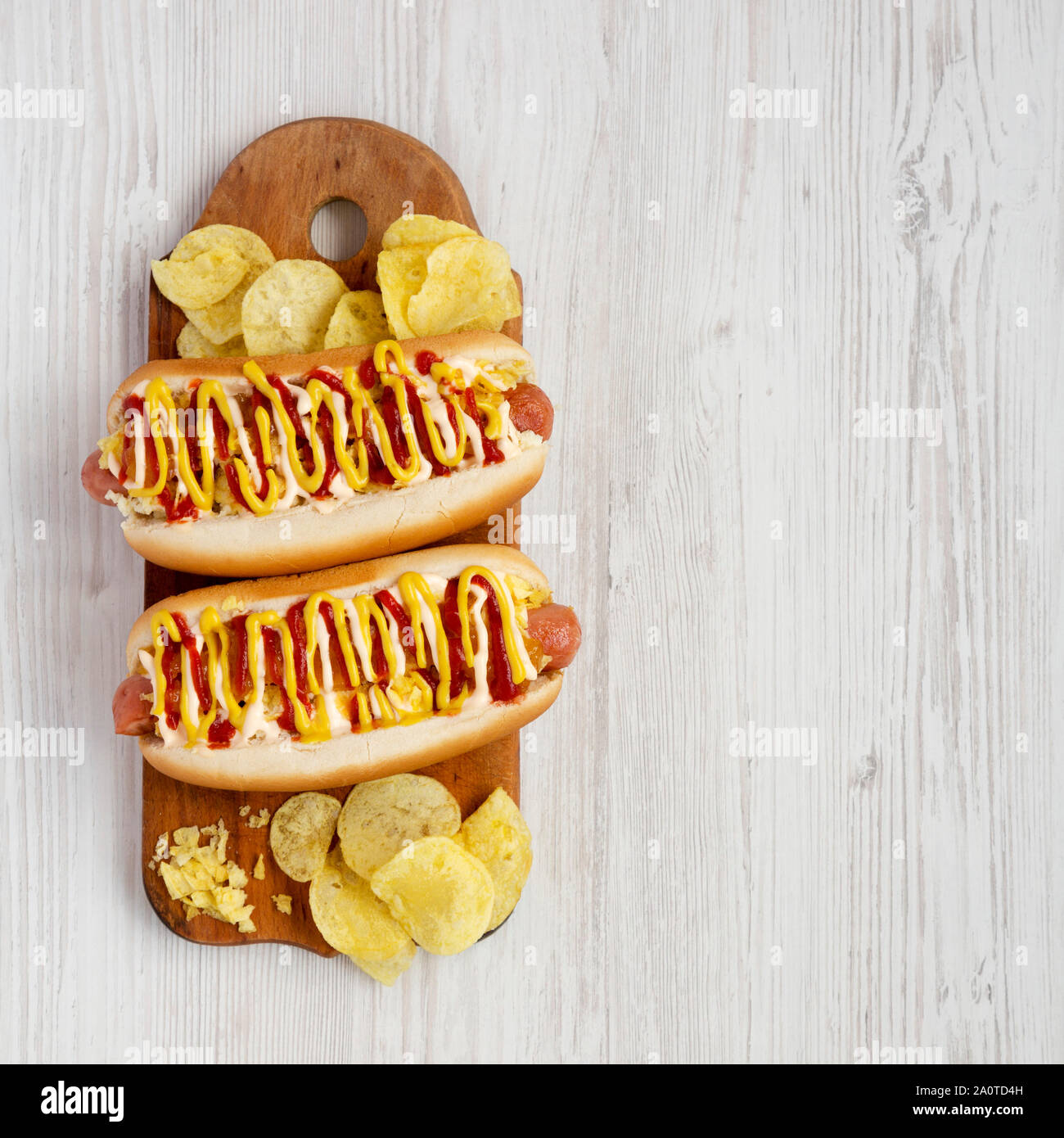 Homemade colombian hot dogs with pineapple sauce, yellow mustard and