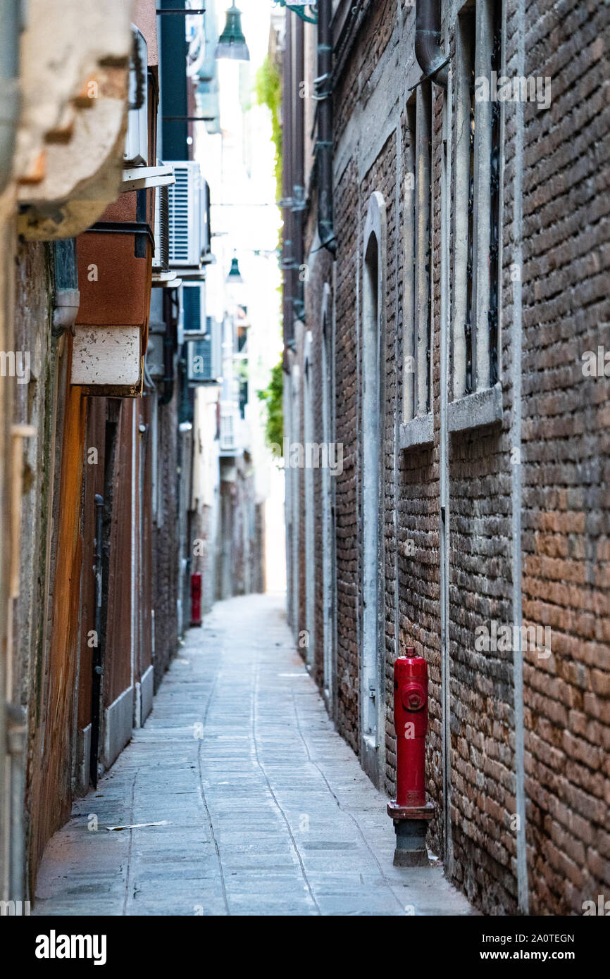 A narrow alleyway / street in Venice, Italy Stock Photo