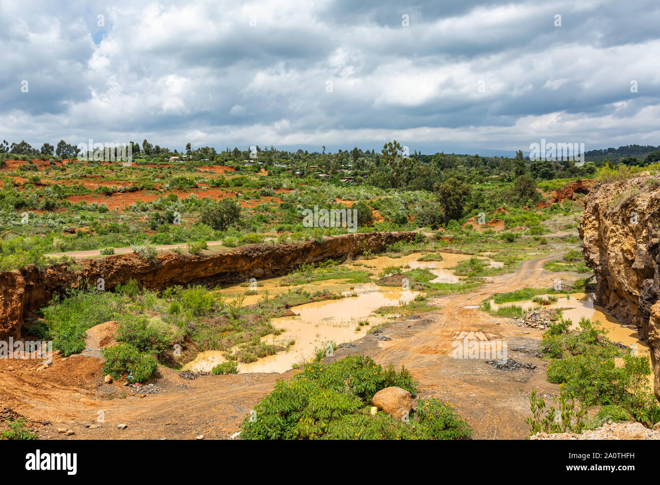 Equittel Quarry, Meru county, Kenya – June 15th, 2019: Landscape photograph of one quarry face used by locals of Kangaita village for valuable income. Stock Photo