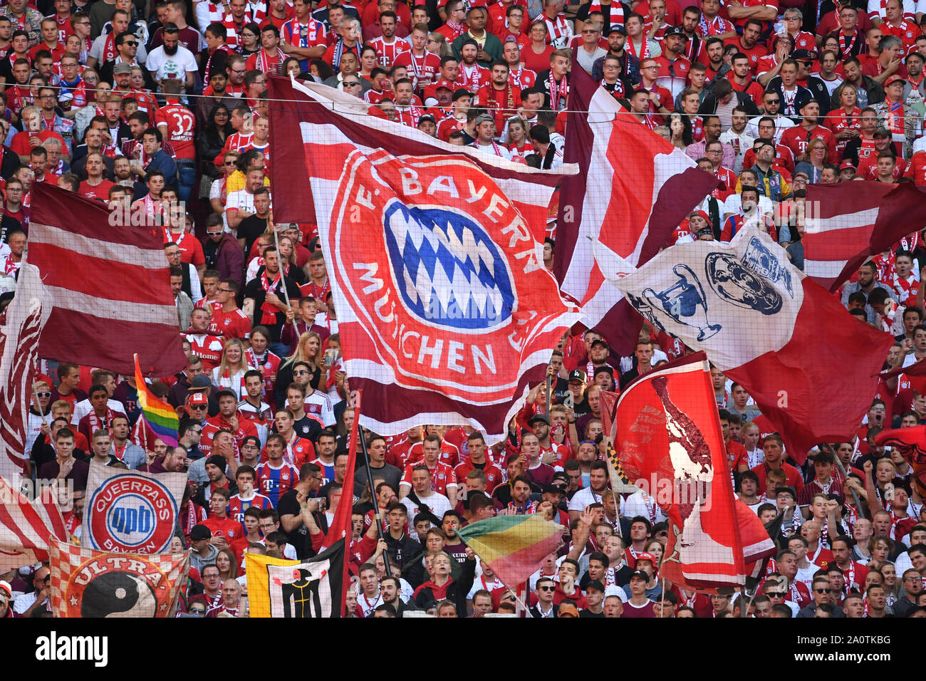 Munich, Deutschland. 21st Sep, 2019. Bayern fans, football fans, fancy dress, fan block, flags, flags with club crests, club emblem. Bundesliga, 5.matchday, matchday05, FC Bayern Munich M) - 1.FC Cologne (K) 4-0 on 21.09.2019 in Muenchen ALLIANZARENA, DFL REGULATIONS PROHIBIT ANY USE OF PHOTOGRAPH AS IMAGE SEQUENCES AND/OR QUASI VIDEO. | usage worldwide Credit: dpa/Alamy Live News Stock Photo