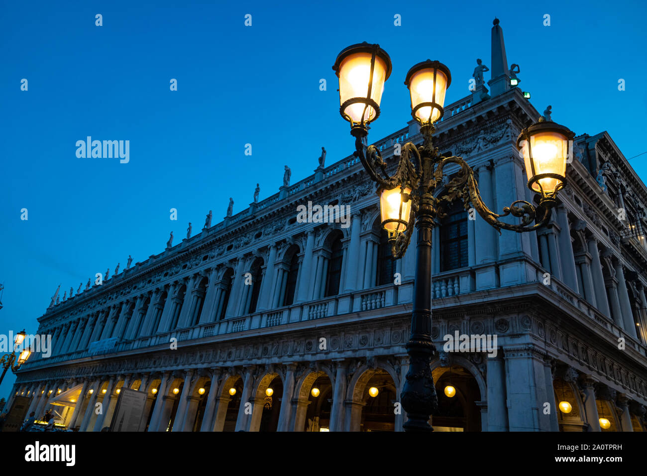 Ornate lamp posts at dusk, St Mark's square, Venice, Italy Stock Photo