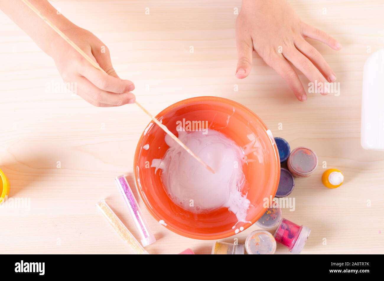 Slime making process. Girl making slime, worldwide popular self made toy  Stock Photo