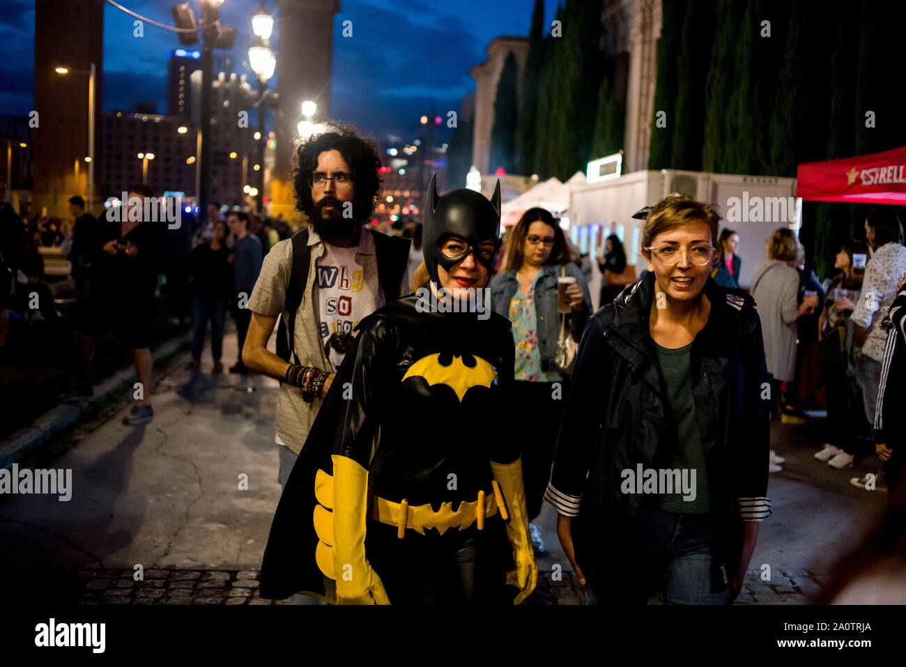A woman goes dressed as Batman in Barcelona on occasion of the character’s 80th anniversary. Stock Photo