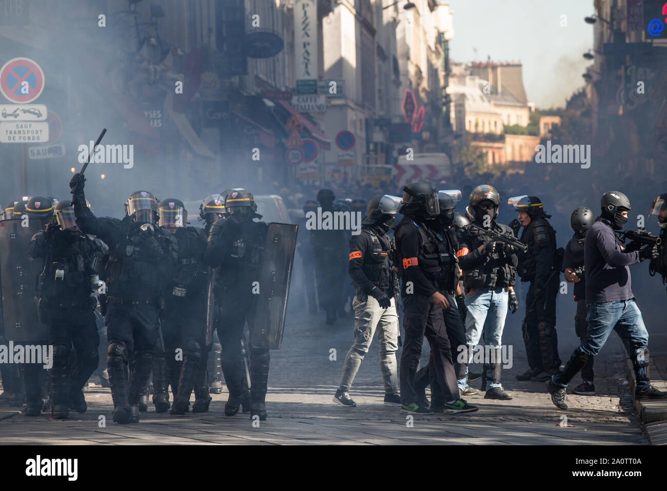 Paris, France. 21st Sep, 2019. Police officers stand guard on the Champs Elysees in Paris, France, Sept. 21, 2019. French police had arrested 137 individuals in Paris by 16:00 local time (1400 GMT), as 'Yellow Vest' protests against President Emmanuel Macron's fiscal policy hit streets again on Saturday. In Paris, 7,500 police officers have been poured in and armored vehicles were deployed to handle more threats of rioting that, according to the government, risks to taint the social movement's 45th weekend of action. Credit: Aurelien Morissard/Xinhua Stock Photo