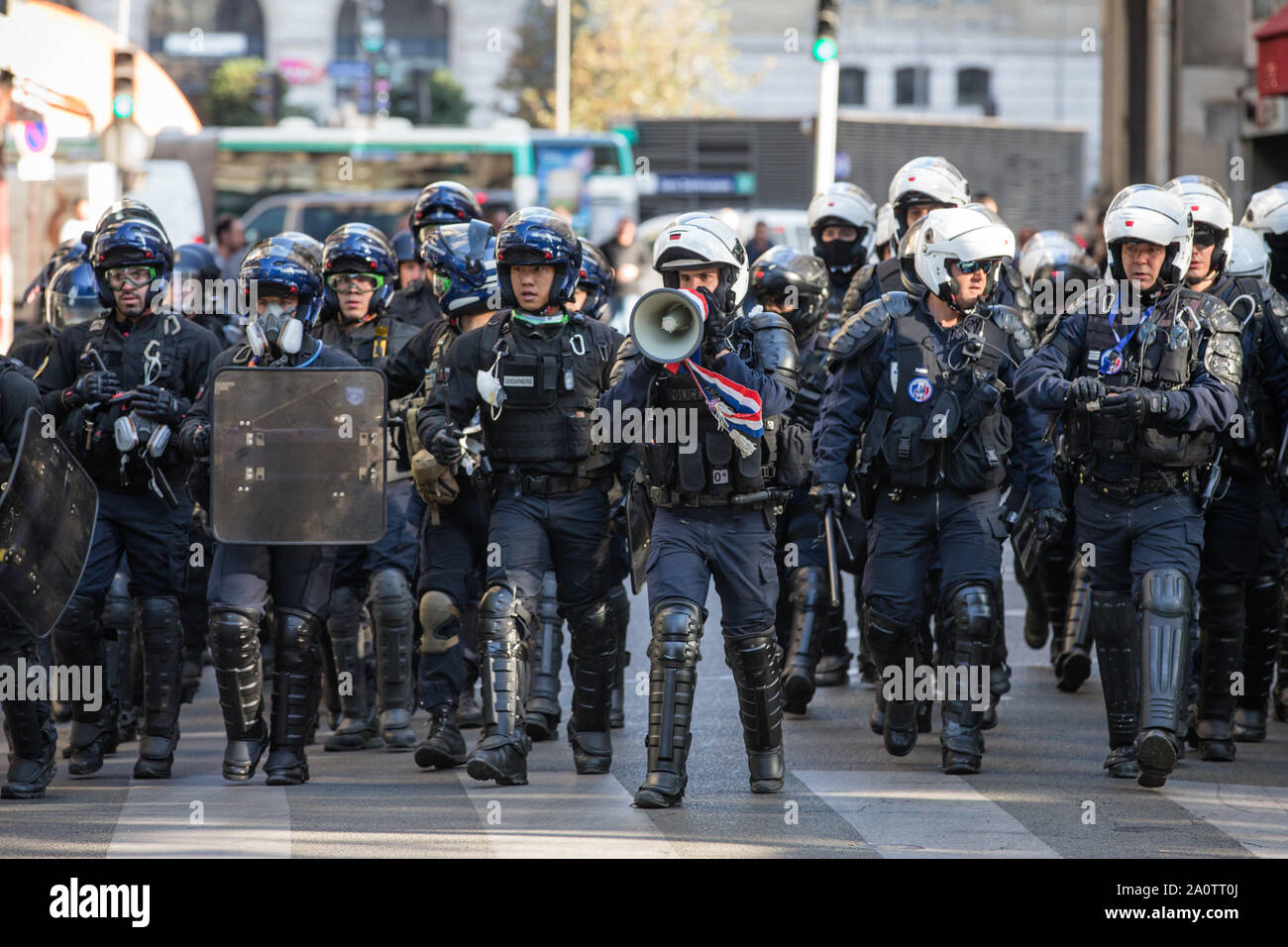 Paris, France. 21st Sep, 2019. Police officers disperse demonstrators in Paris, France, Sept. 21, 2019. French police had arrested 137 individuals in Paris by 16:00 local time (1400 GMT), as 'Yellow Vest' protests against President Emmanuel Macron's fiscal policy hit streets again on Saturday. In Paris, 7,500 police officers have been poured in and armored vehicles were deployed to handle more threats of rioting that, according to the government, risks to taint the social movement's 45th weekend of action. Credit: Aurelien Morissard/Xinhua Stock Photo