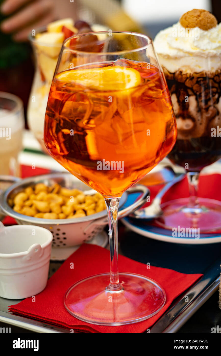 Aperol spritz (Spritz Veneziano) at a cafe in Venice, Italy Stock Photo -  Alamy