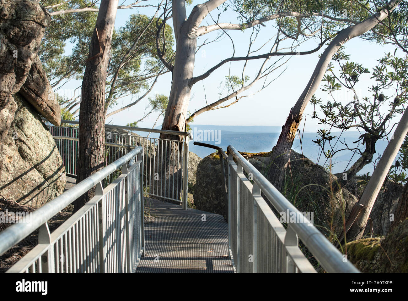 The parapet walk around part of the perimeter of the peak of Pigeon House Mountain on the New South Wales south coast in Australia Stock Photo