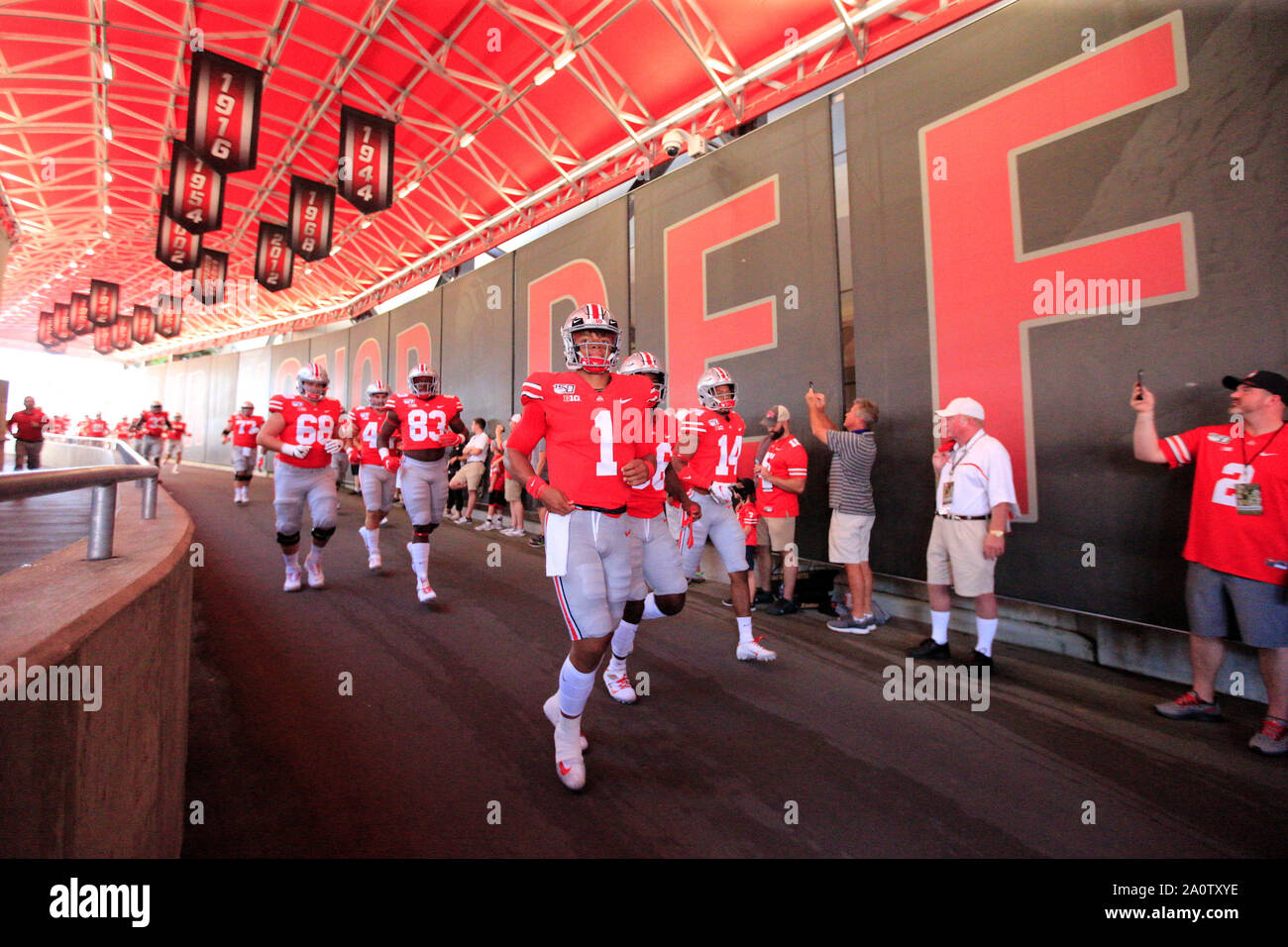 Columbus, Ohio, USA. 21st Sep, 2019. Justin Fields (1) of the Ohio State Buckeyes runs down the tunnel prior to the kickoff at the NCAA football game between the Miami Redhawks & Ohio State Buckeyes at Ohio Stadium in Columbus, Ohio. JP Waldron/Cal Sport Media/Alamy Live News Stock Photo