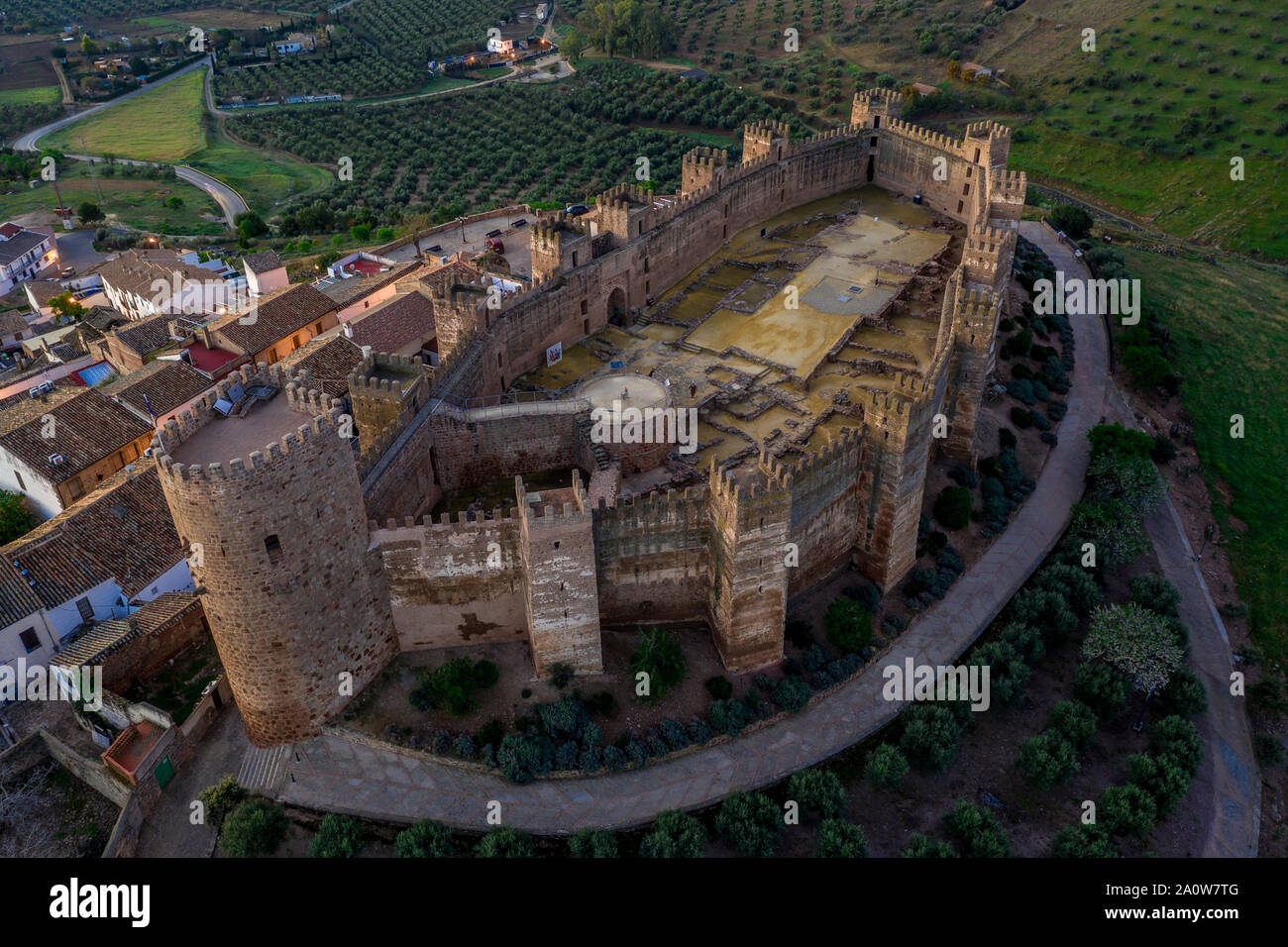 Castillo de Bury Al-Hammam in Banos de la Encina La Mancha province Spain old medieval castle with 14 towers from the air panorama Stock Photo
