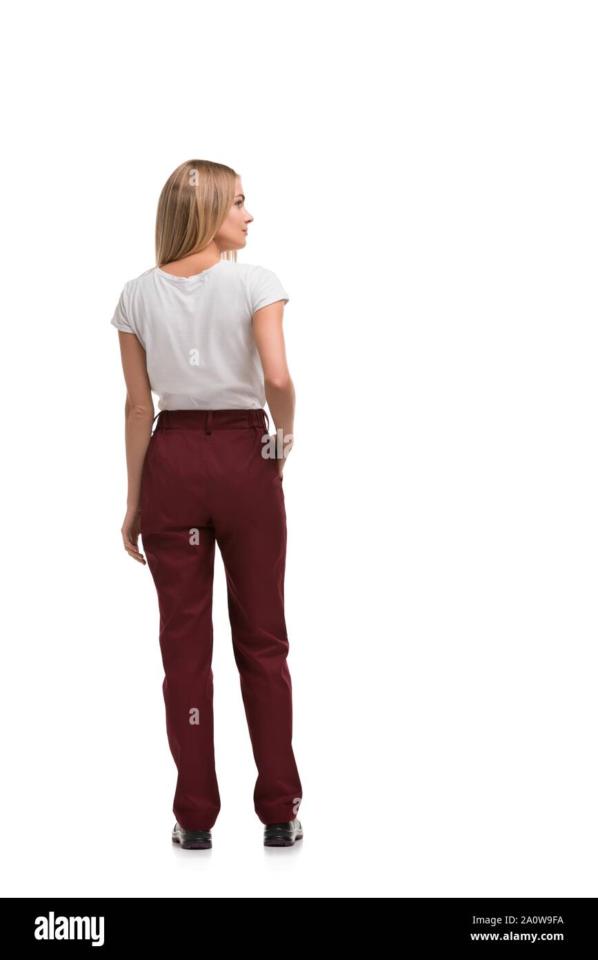 Slim blonde in burgundy work trousers, tshirt and boots isolated  full-length rearview Stock Photo - Alamy