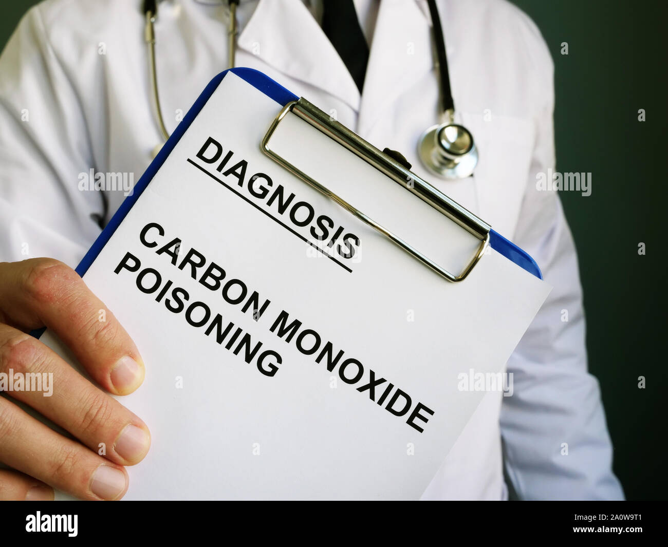 Doctor holds diagnosis Carbon monoxide poisoning. Stock Photo