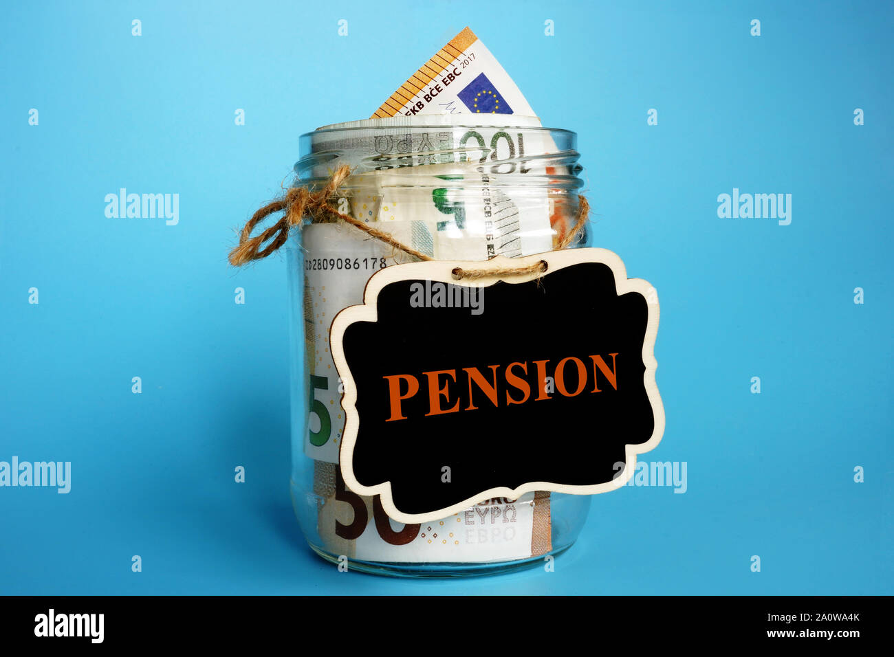 Jar with sign pension and European currency euro as savings for retirement in Europe. Stock Photo