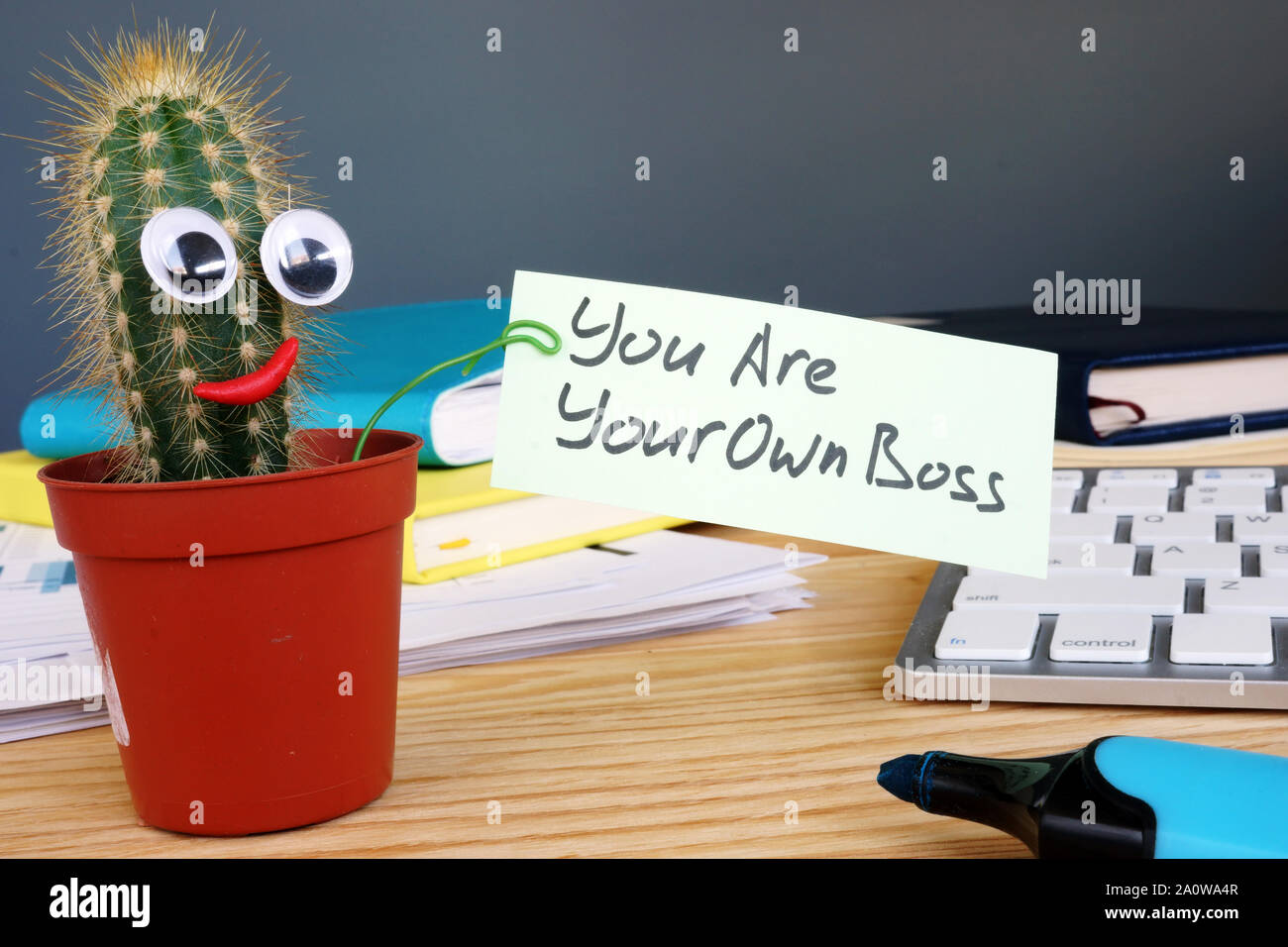 You are your own boss sign on the desk. Stock Photo