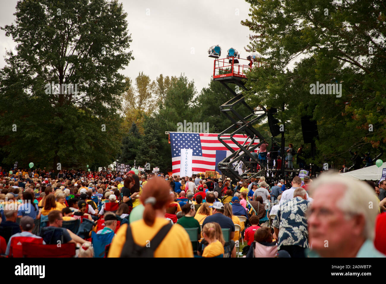 A crowd gathers during the Polk County Steak Fry, Saturday, September 21, 2019 at Water Works Park in Des Moines, Iowa. The steak fry was the largest in Iowa's history and was attended by 12,000 Democrats from around Iowa. The event drew in 17 candidates for the democratic nomination for president of the United States. The Iowa Caucasus are Monday, February 3, 2020 and although not a primary will narrow down the field of candidates for president before the first election primary in the state of New Hampshire. Stock Photo