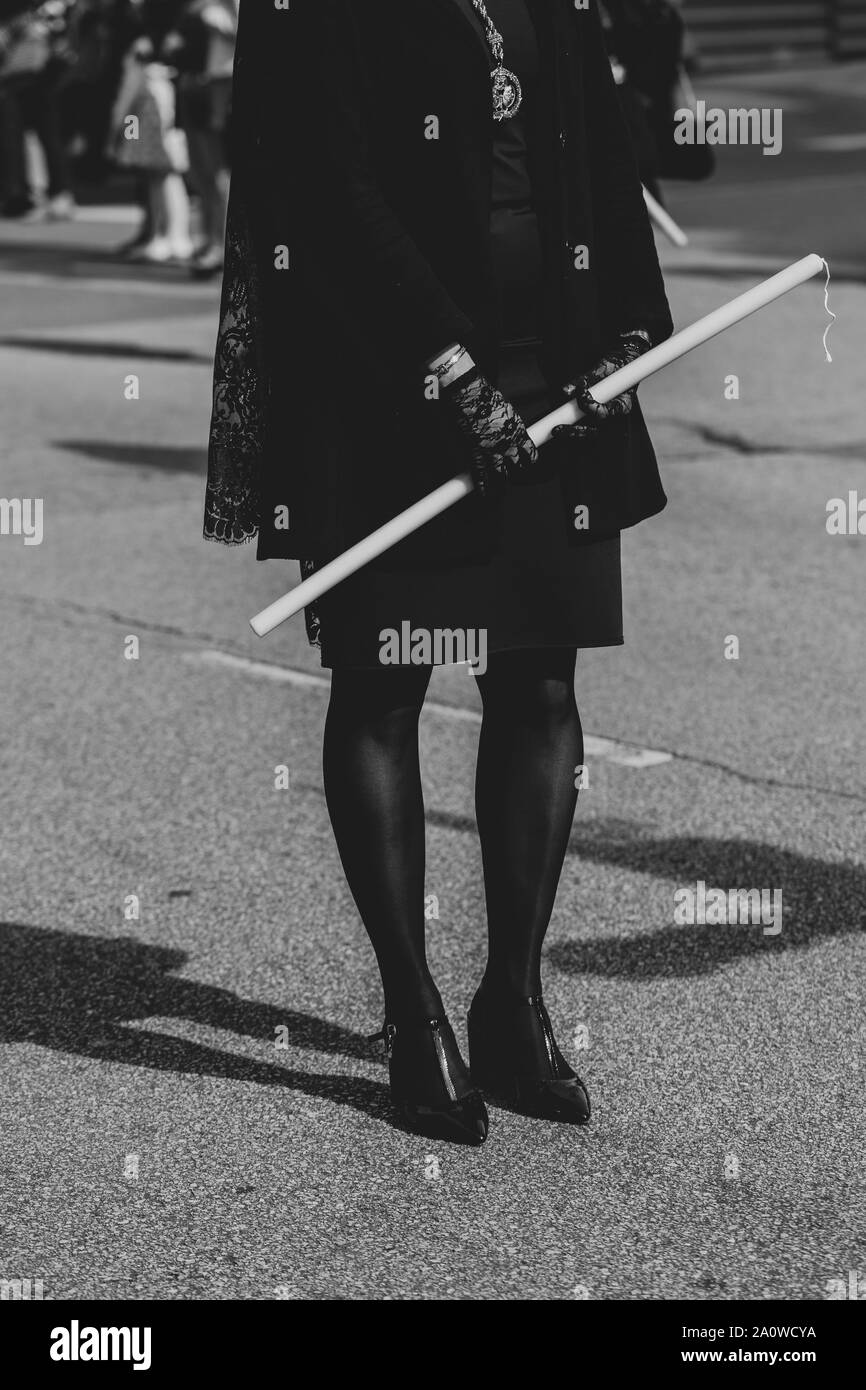 'Manola' is holding a candle in a procession, Holy Week Stock Photo
