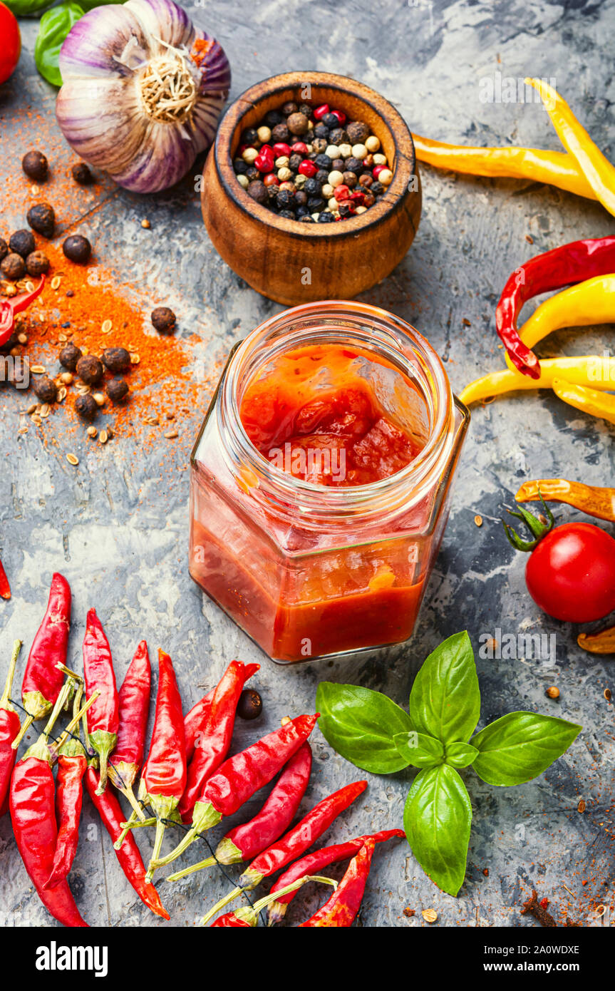 Spicy hot chili sauce with of chilli pepper Stock Photo - Alamy