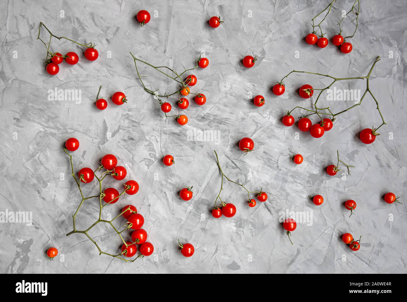 Cherry tomato pattern on a gray background. Flat lay. Top view. Stock Photo