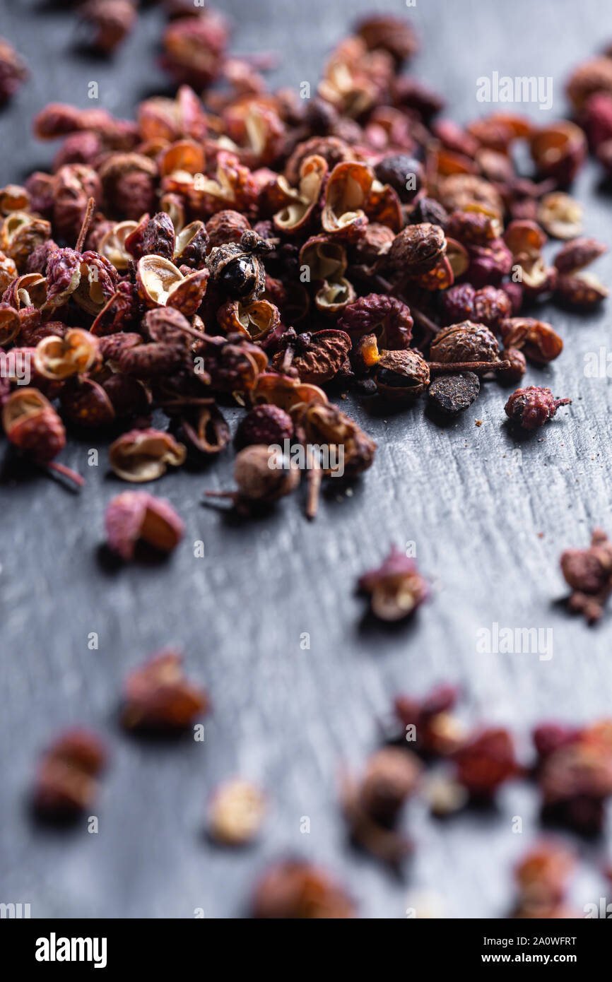 Sichuan peppercorns on black background Stock Photo